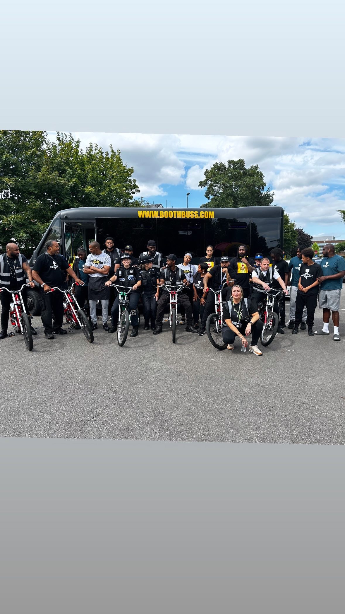CAV community group with bikes and the Booth Buss at an outdoor event
